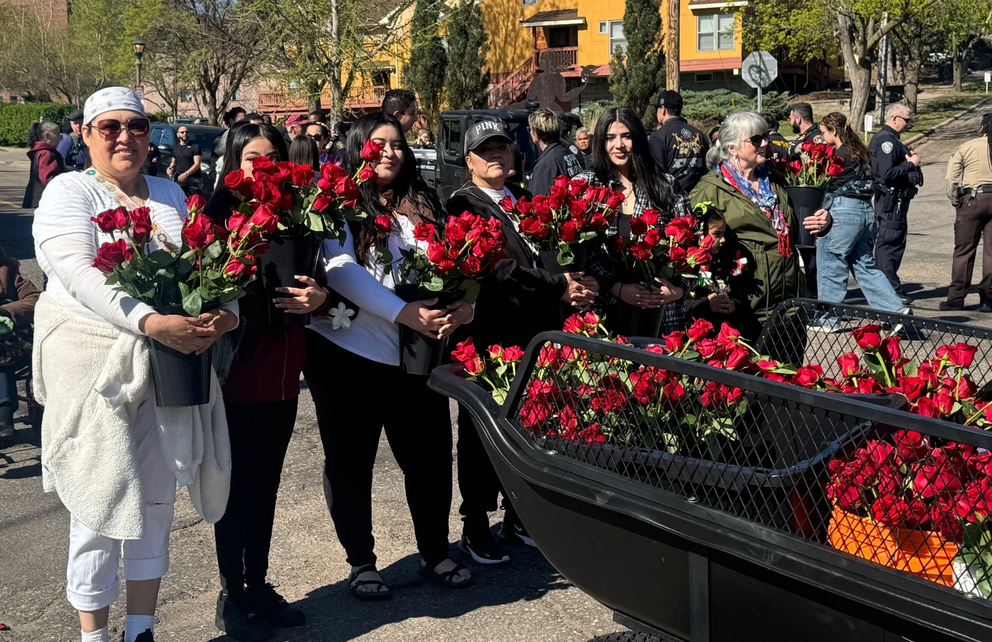 Our Lady of Fátima image carried in procession at the Cinco de Mayo Parade, surrounded by participants.