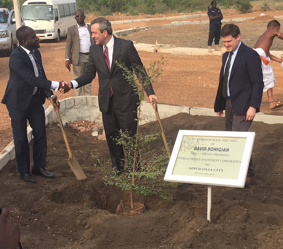 OPIC Executive Vice President David Bohigian joins OPIC client GHL Bank CEO Dominic Adu to plant a tree commemorating the construction of low income homes at Appolonia City in Ghana.