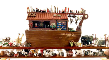 Folk Art Noah’s Ark by Virgil Myers, dated 1995—all handmade with 97 pairs of animals, including kangaroos, crickets, ladybugs, hummingbirds, flying squirrels, fish, lobsters, all manner of birds, beavers, opossums, pandas, and more. Hailing from Wayne City IL, Myers started carving as a boy. A farmer by trade, Myers continued to created carved scenes throughout his life.