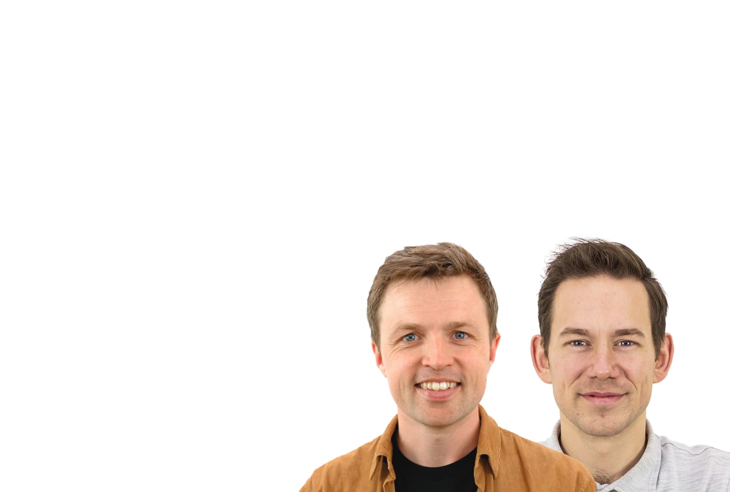 Two smiling men against a white background, one wearing a brown corduroy jacket, the other a light gray shirt.