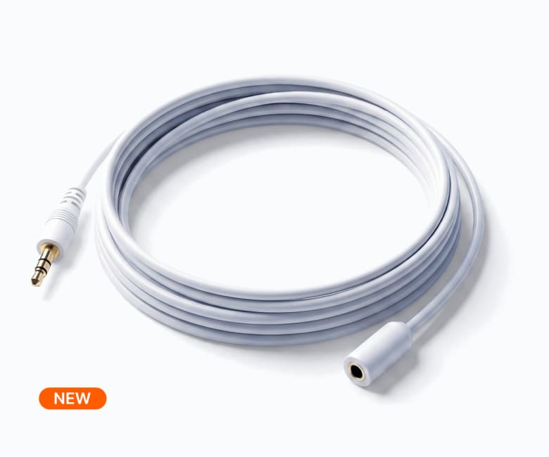 White 3.5mm male to female stereo audio extension cable coiled, with gold-plated connector, labeled NEW