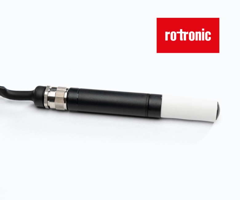 Rotronic temperature and humidity probe sensor with white tip, black body, and cable connector