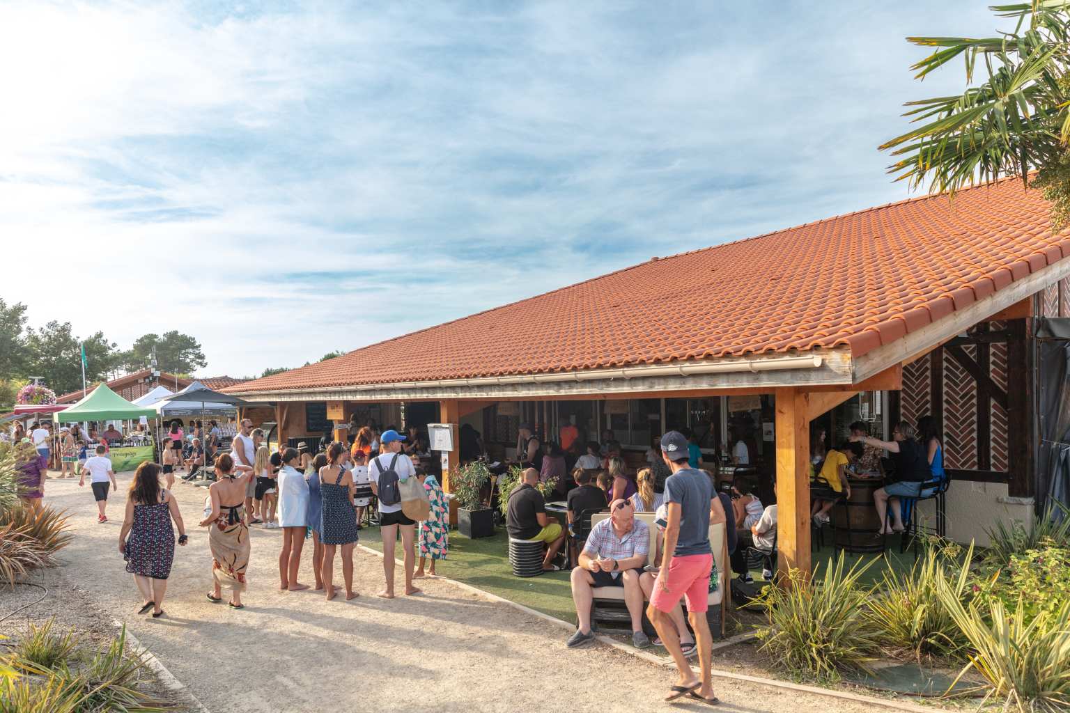 Bar terrace at the side of the restaurant at Les Vignes campsite, Landes, France