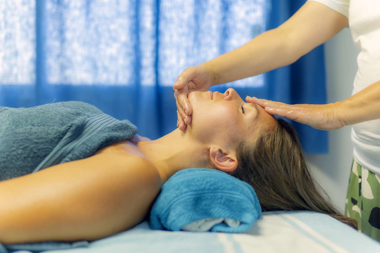 Lady having a facial massage in the spa at Le Castellas campsite in the Languedoc