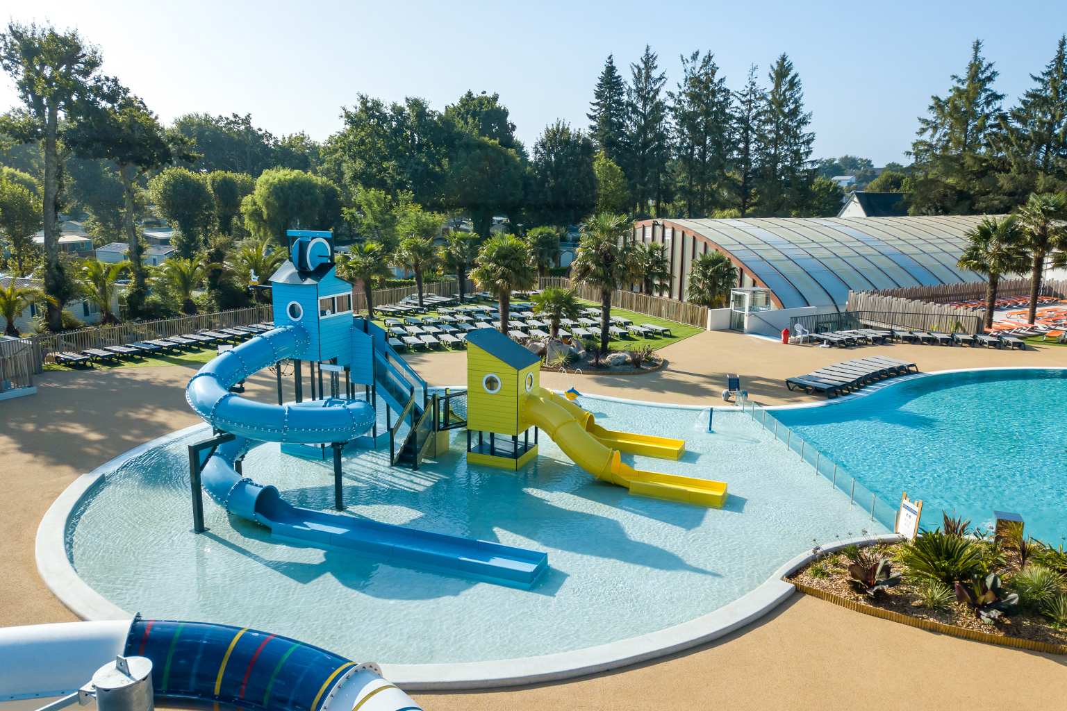 Kids pool with waterslides close to the covered pool at Le Port de Plaisance, Benodet, Brittany