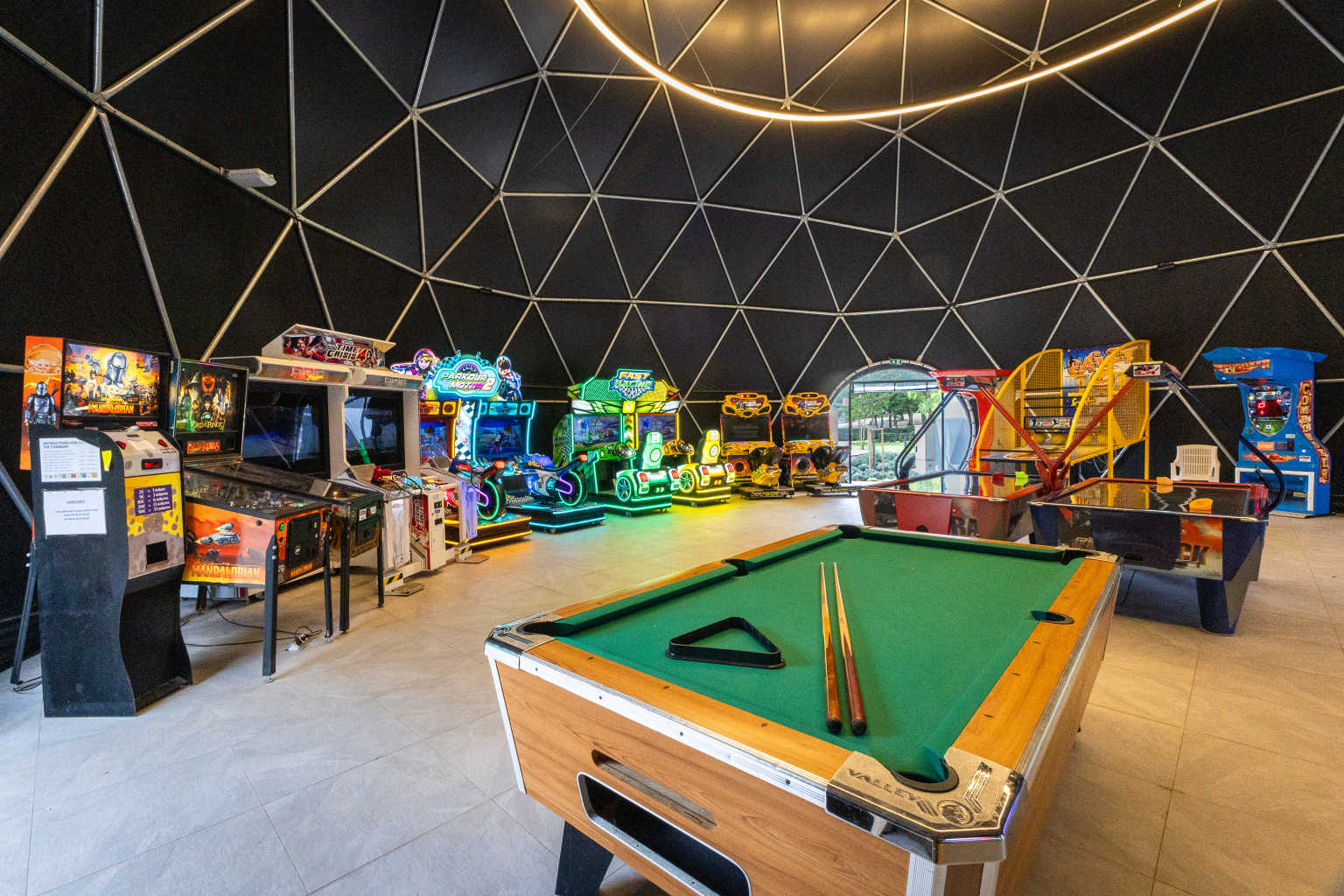 Dome games room with pool table and games machines at the play park at Bijela Uvala campsite, Porec, Croatia