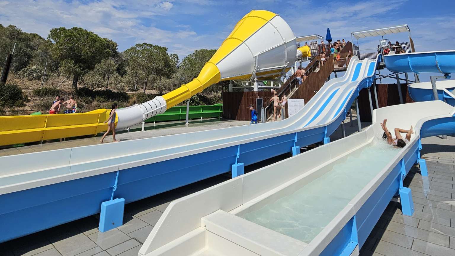 Vilanova Park campsite on the Costa Dorada, 2 lane toboggan waterslide, girl on the twisting waterchute, and cone waterslide