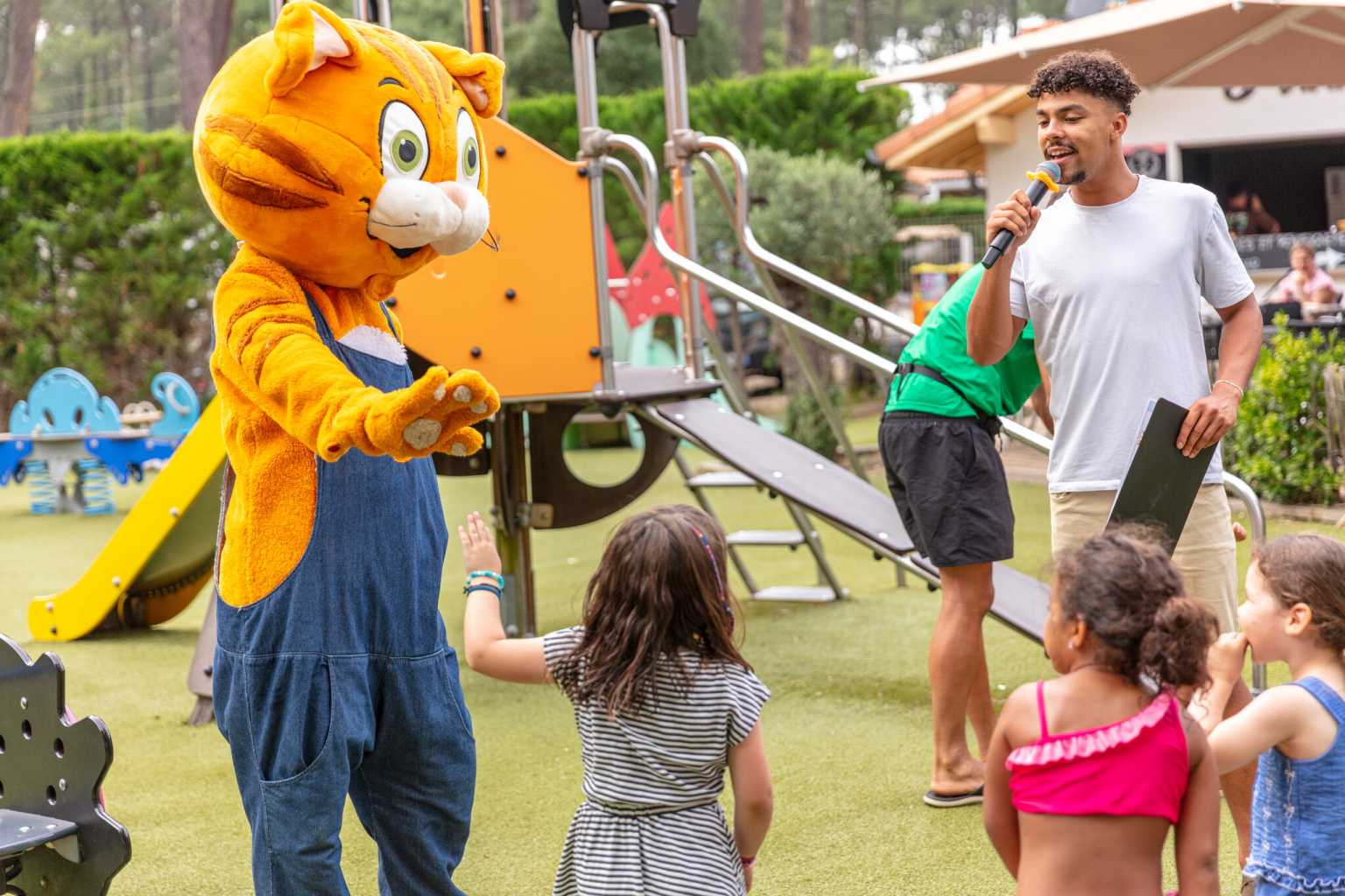 Kids with the Topi mascot at the play area at Lou Pignada Messanges