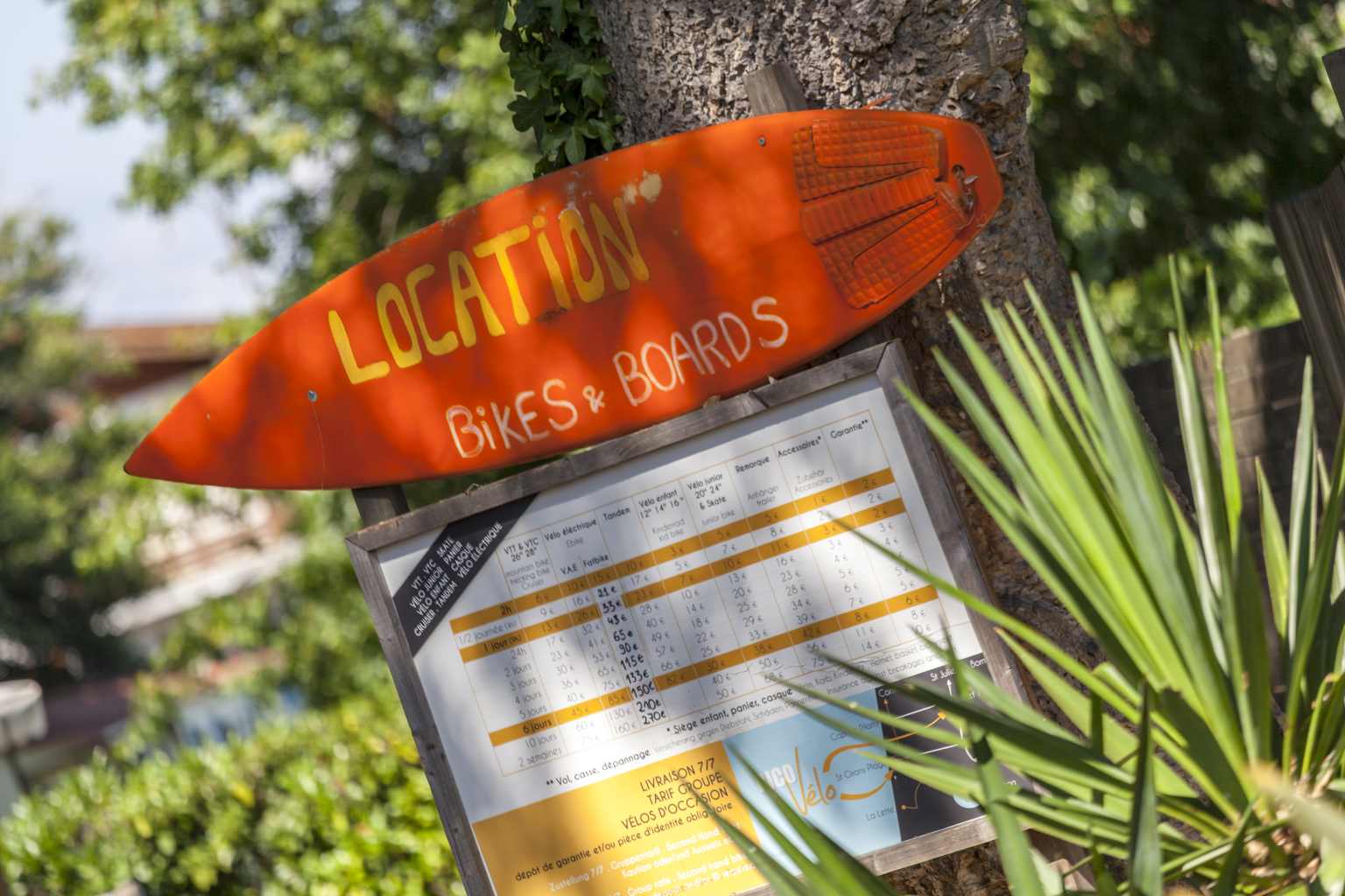 Bike and boards hire sign at Le Soleil des Landes campsite in Landes, France