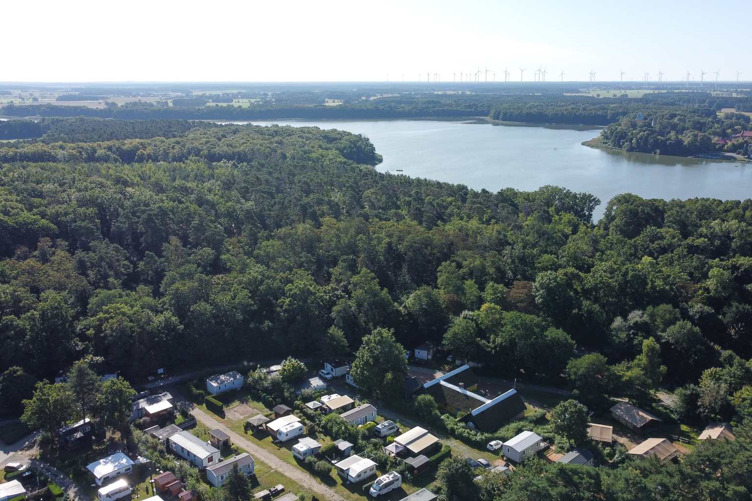 Aerial view of the woods and lake next to Spreewaldtor campsite, Berlin Brandenburg, Germany