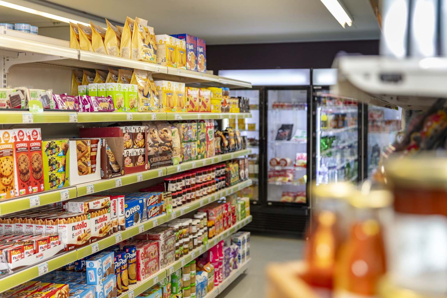 Pointe du Gironde campsite, Gironde, onsite shop interior, with shelves full of snacks