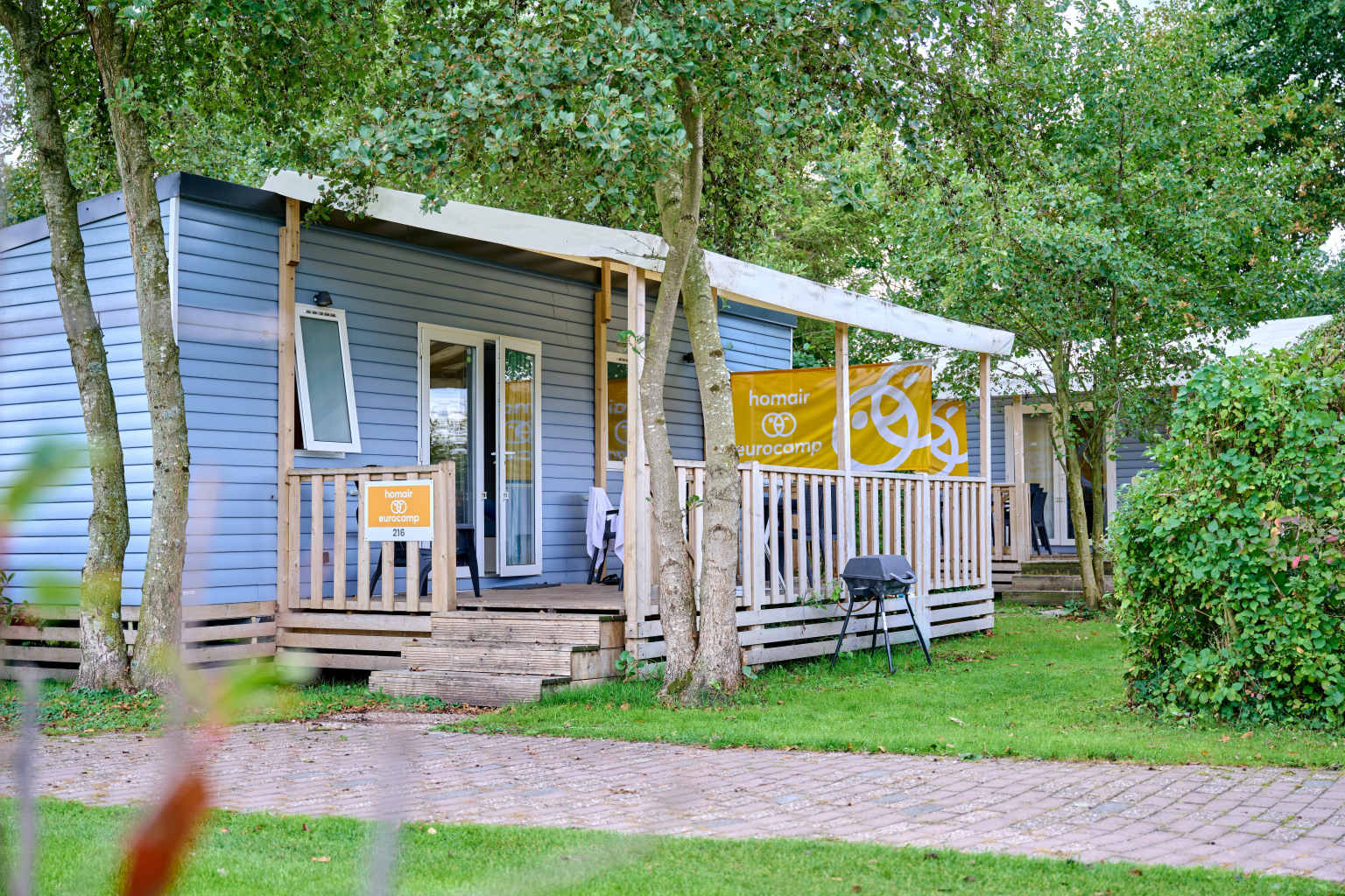 Holiday homes with covered decking at Koningshof campsite, in South Holland