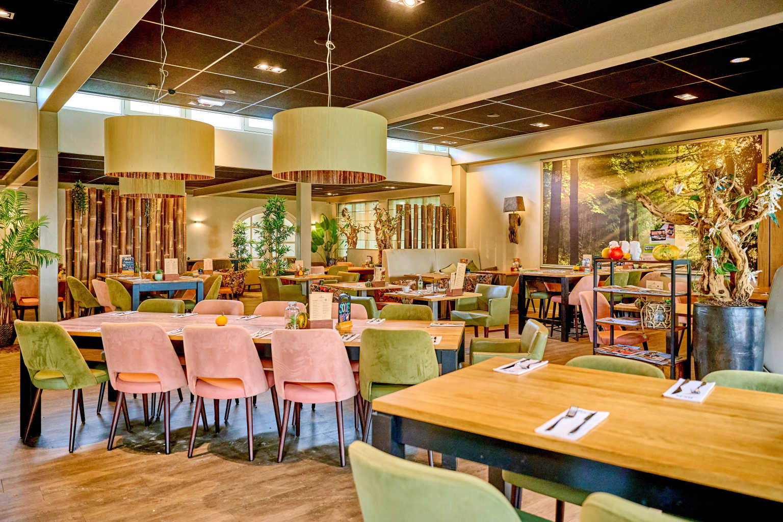 Restaurant interior - tables and plush chairs, at De Flaasbloem campsite in the Netherlands