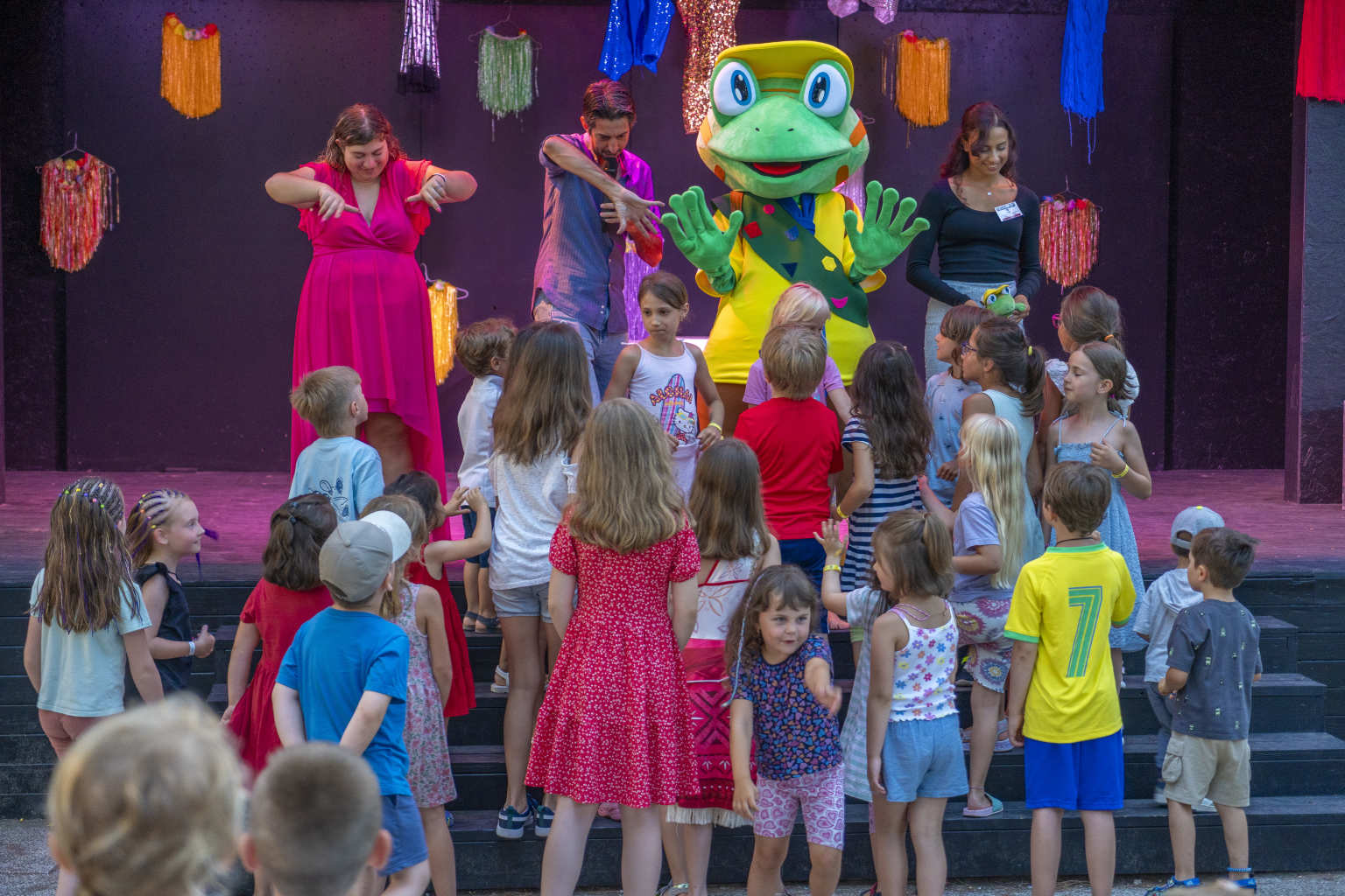 Kids watching the parc mascot on stage at Jesolo Mare Camping Village Italy