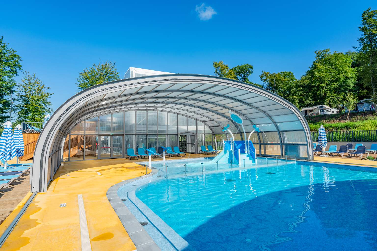 Inside the covered pool with toddler slide at Lac des Vieilles Forges Campsite, Ardennes, France