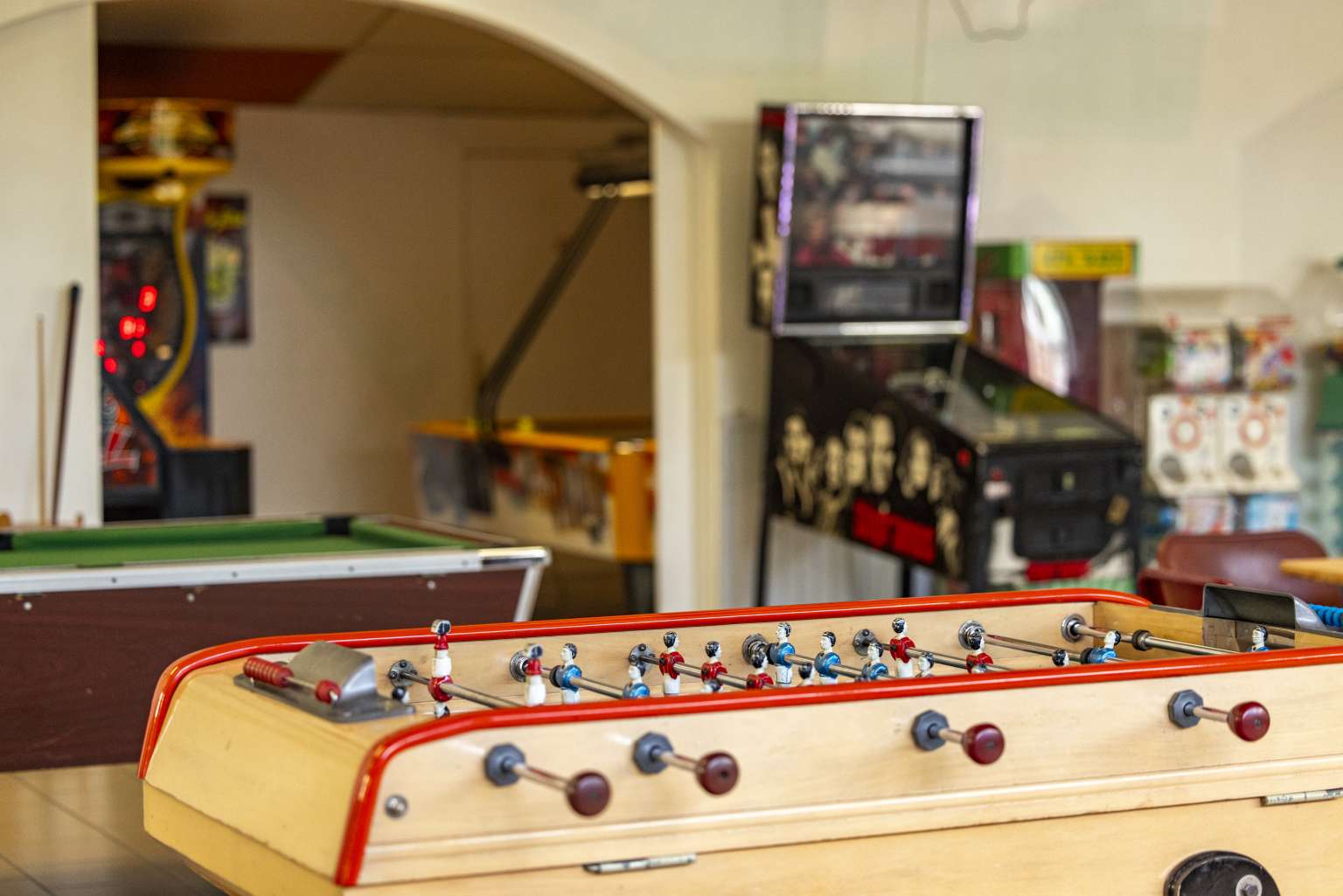 Table football and pool table in the games room at Les Fontaines campsite, Ivry-la-Bataille, France