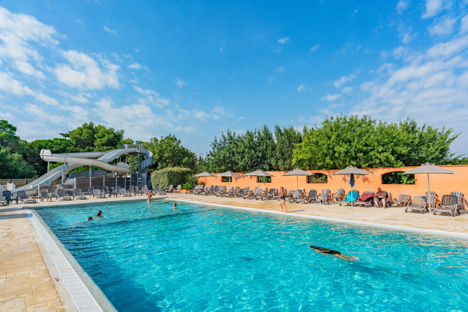 Swimming pool with sunloungers at Ma Prairie, Roussillon, France