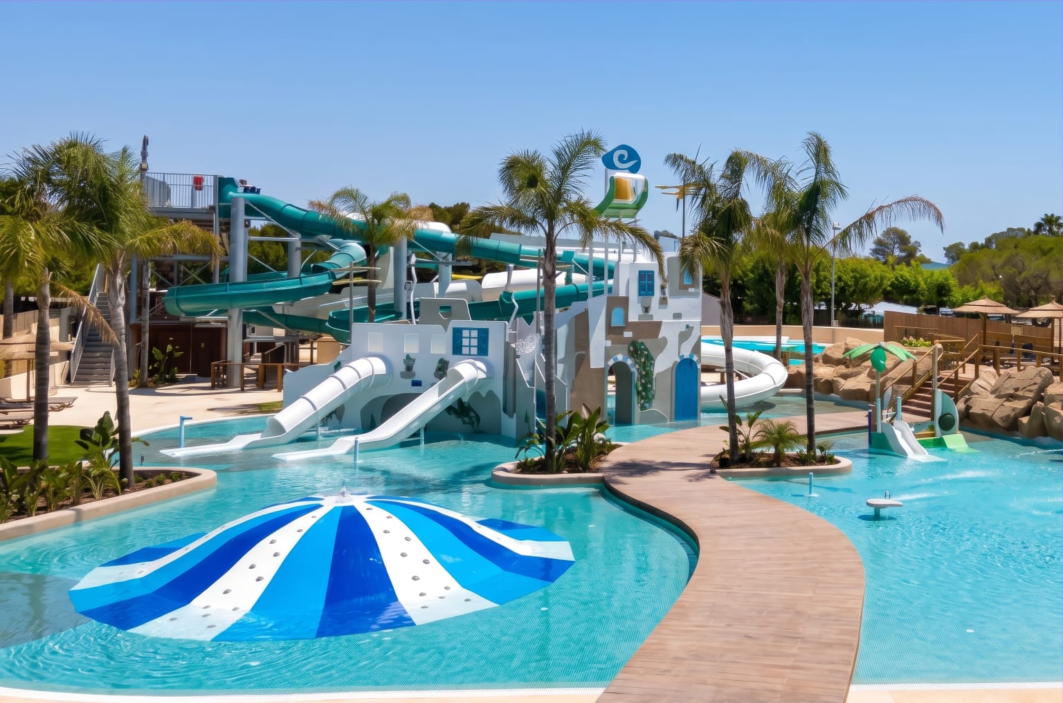 Kids pool with house and slides, water mushroom, big waterchutes behind, Creixell Beach Resort on the Costa Corada