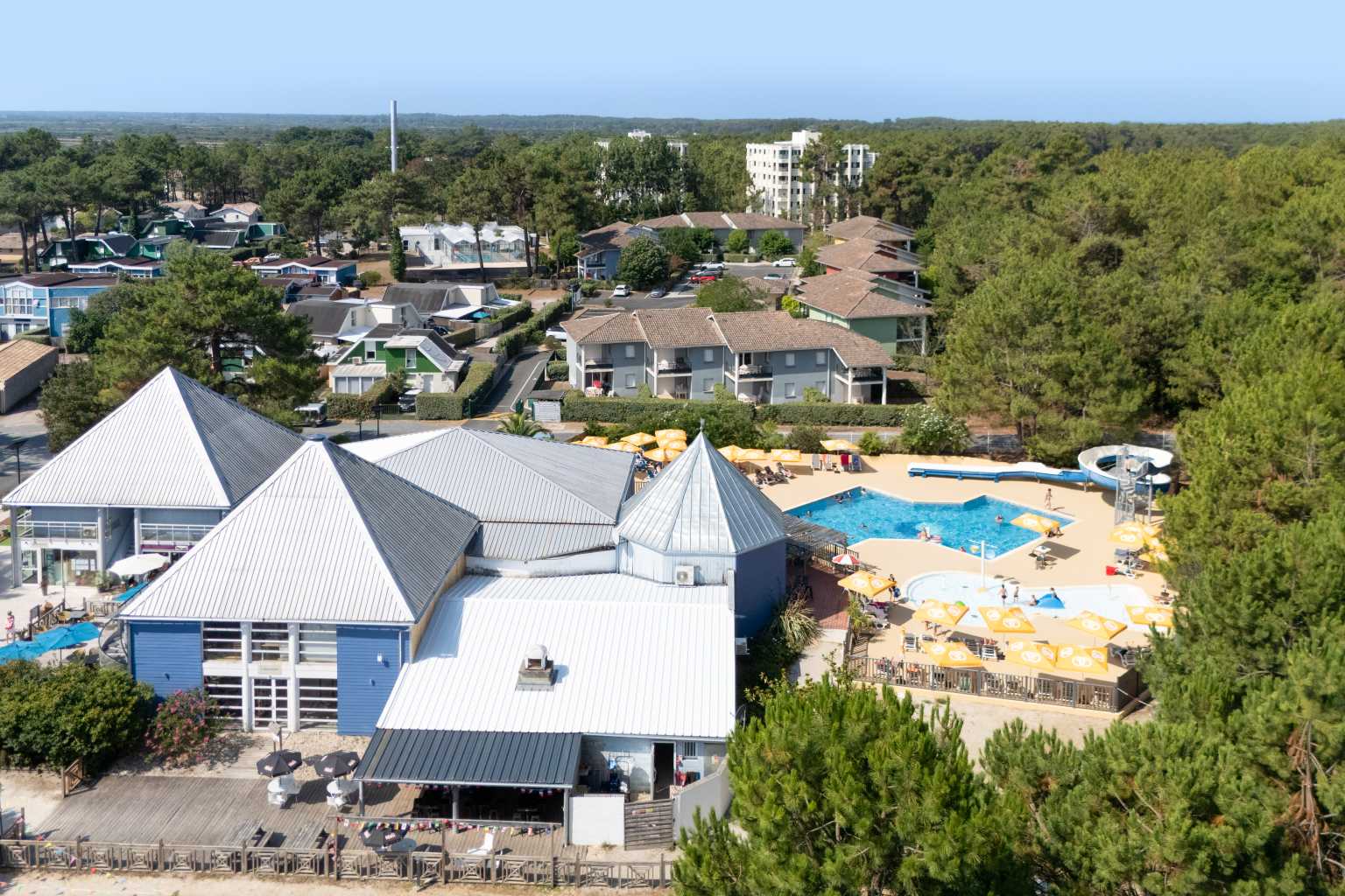 Aerial view of the main building and pool complex on La Pointe du Médoc campsite