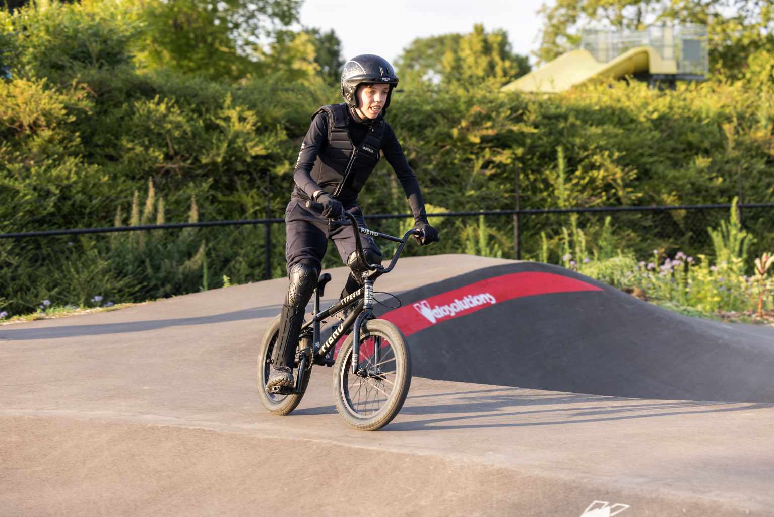 Child on BMX bike on track, at Camping De Twee Bruggen in the Netherlands