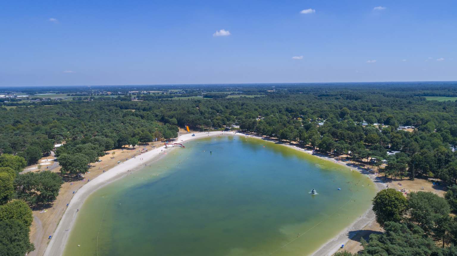 Aerial view of lake and lake beach at Vakantiepark de Bergen, Netherlands