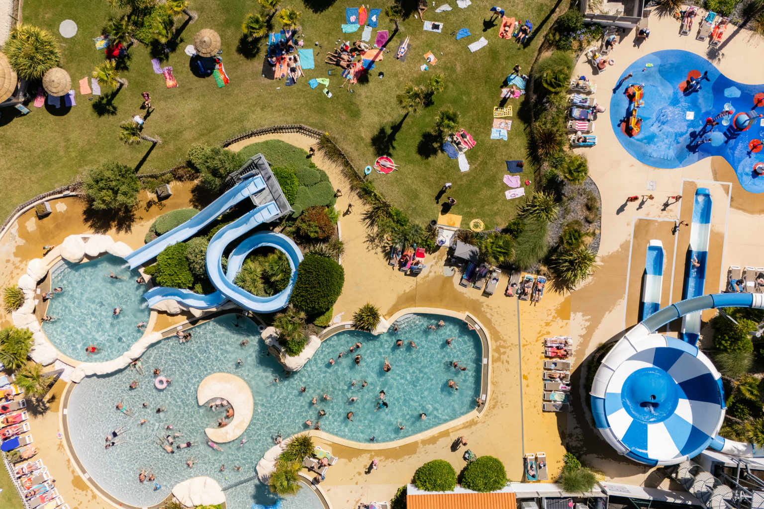 Pool area with waterslides at Camping Les Places Dorées in the Vendée