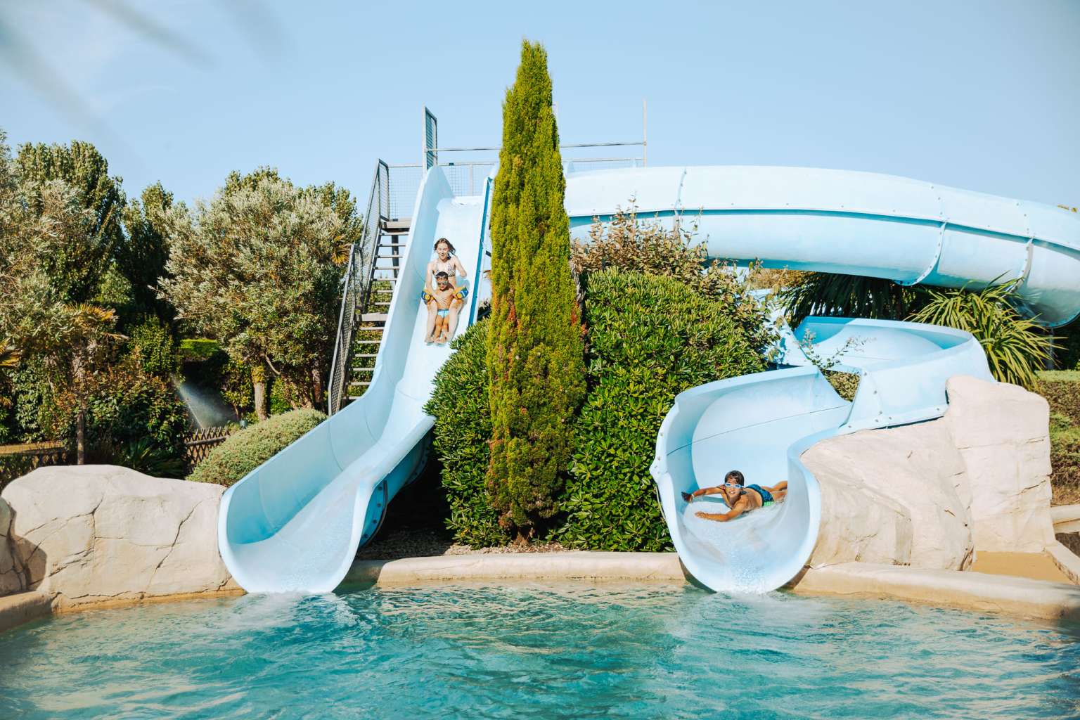 Pool area with waterslides at Camping Les Places Dorées in the Vendée