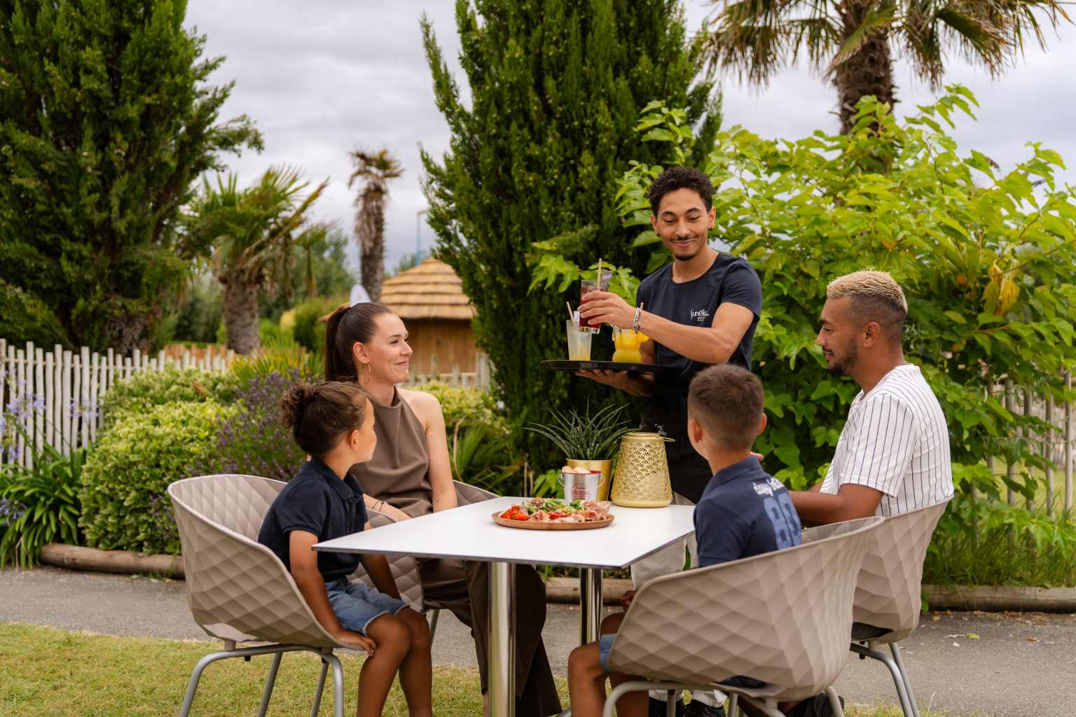 Family having drinks at Camping Les Places Dorées in the Vendée