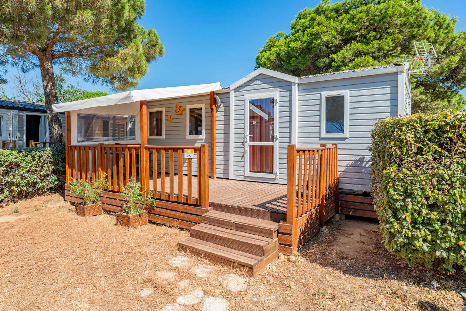 Holiday home with decking and canopy at Novela Port La Nouvelle campsite, Languedoc