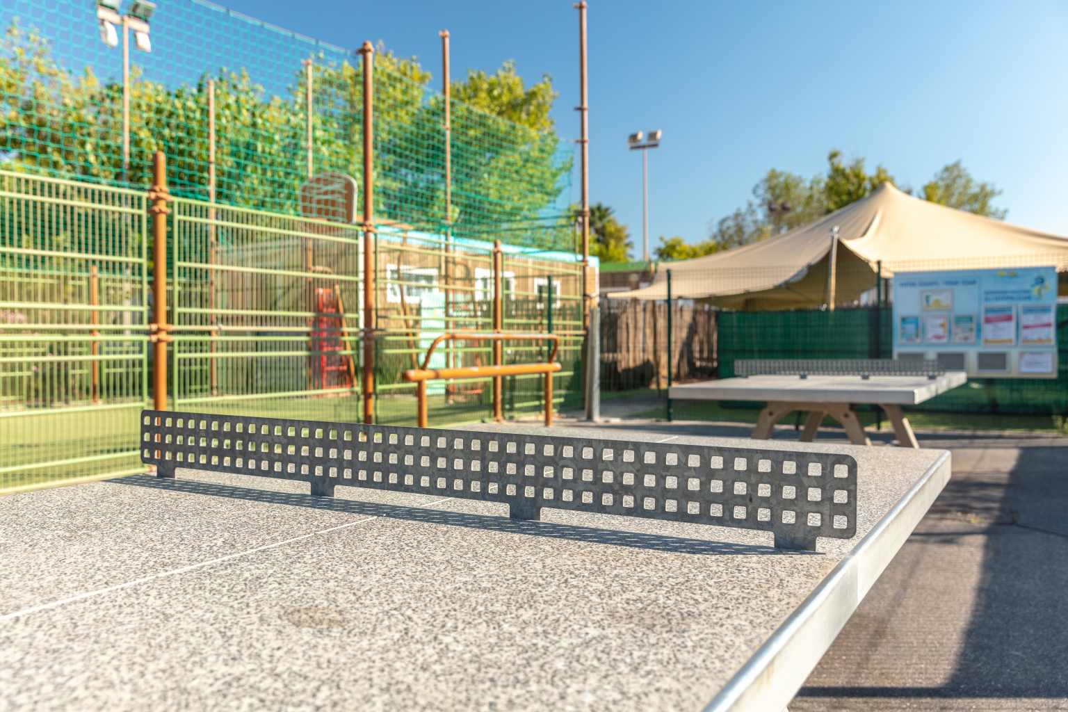 2 table tennis tables next to the multi sports court at Plage et le Bord de Mer campsite, Languedoc