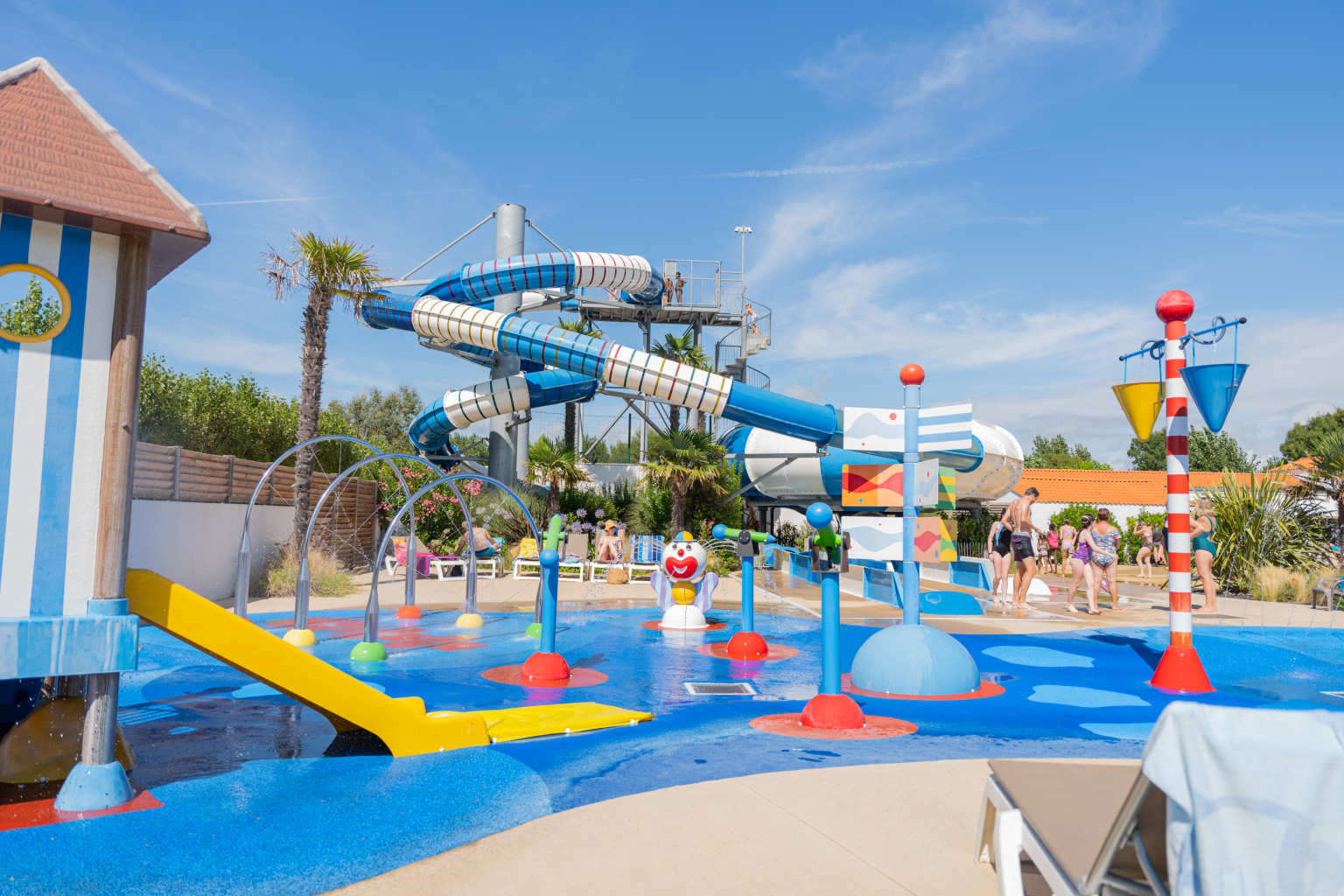 Pool area with waterslides at Camping Les Places Dorées in the Vendée