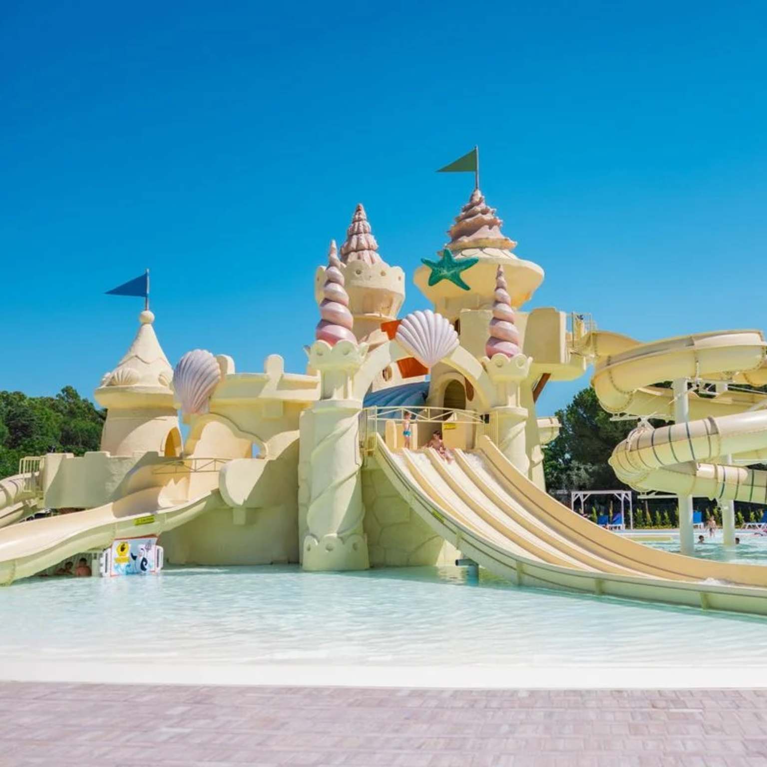 Splash playground, giant sandcastle with waterslides at Le Capanne, Italy