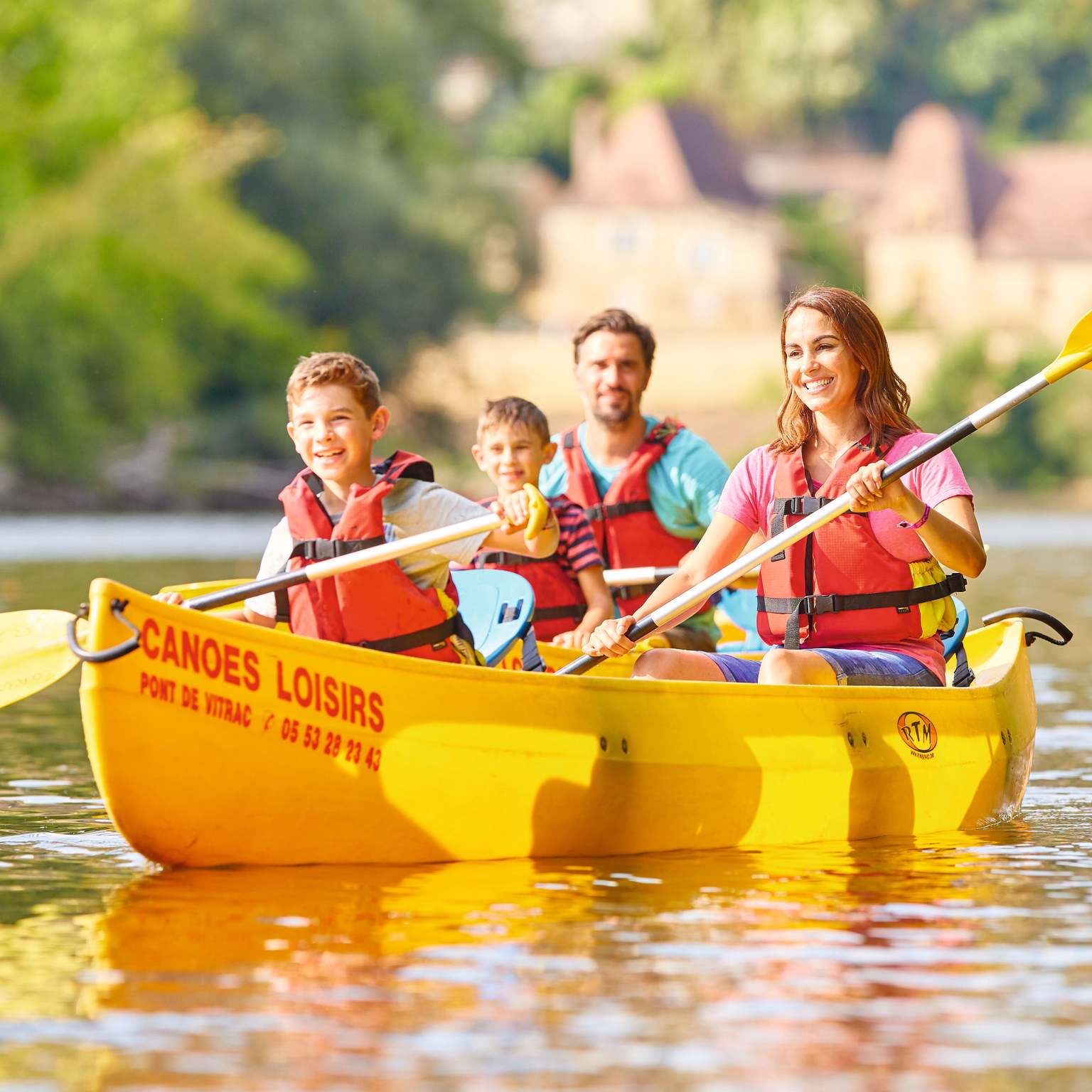 Family canoeing on the river