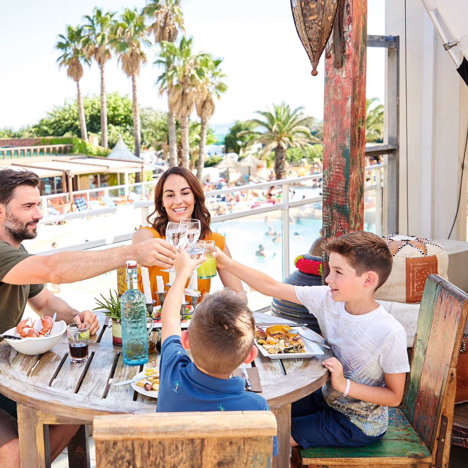 Family meal by the pool