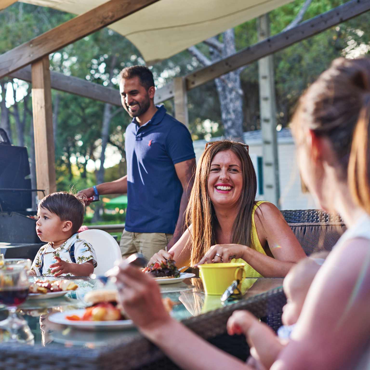 Toddler family BBQ on the decking, accommodation