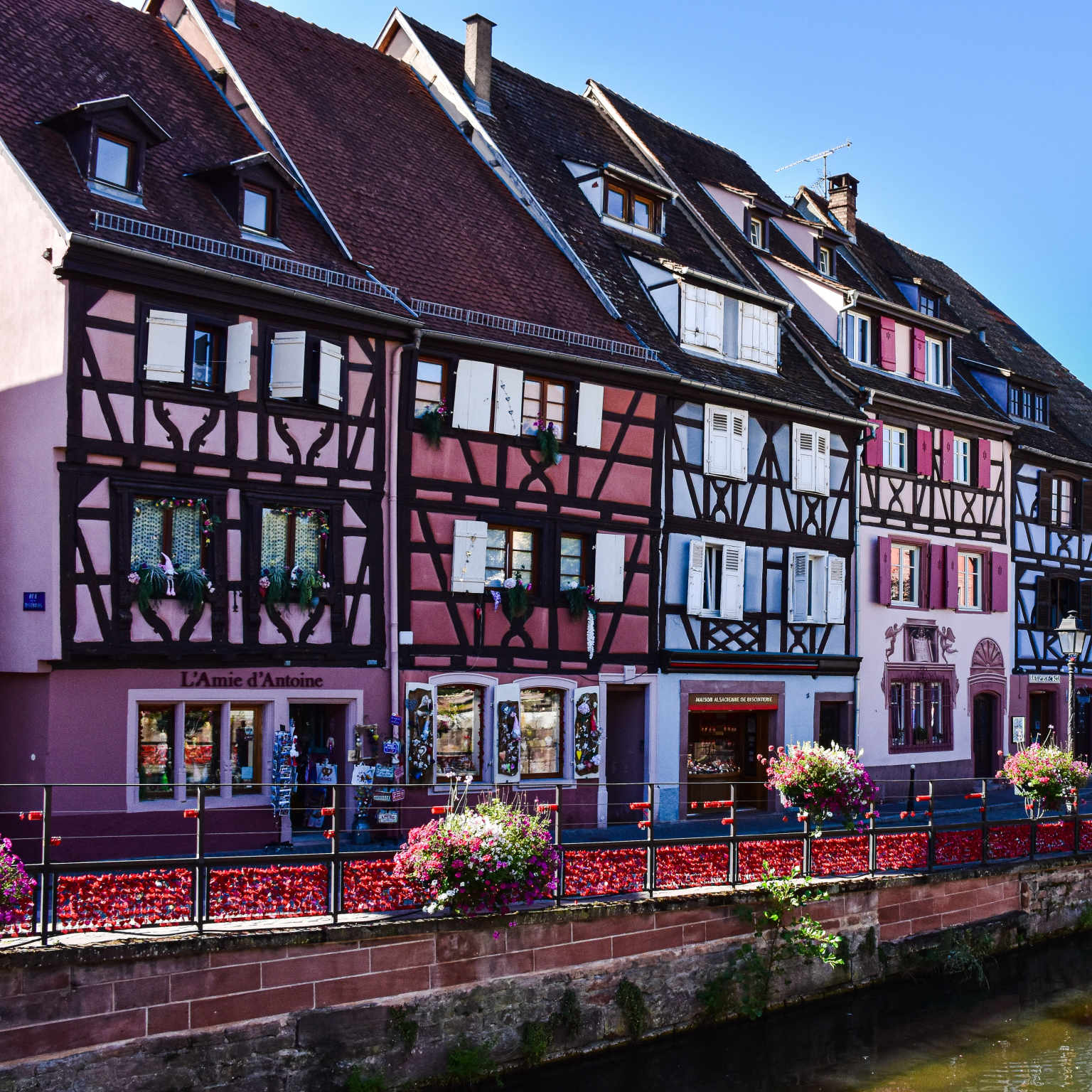 colourful houses by river in Alsace, France