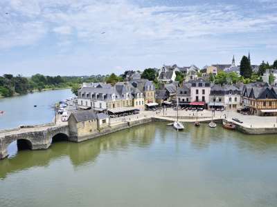 The bridge and waterfront buildings and 4 moored boats at Auray, South Brittany, France