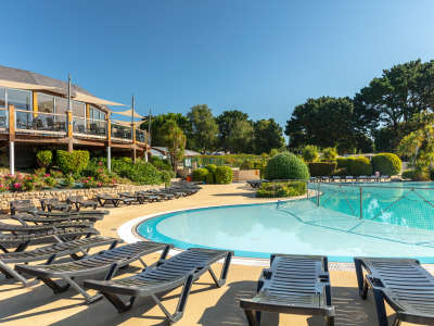 sunloungers by the pool, under the restaurant at la grande metairie, campsite, south brittany