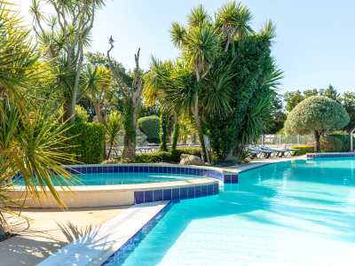 circlular jacuzzi, under trees, next to the main pool at la grande metairie, campsite, south brittany