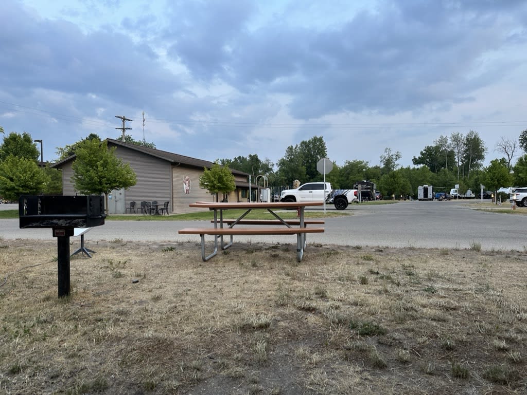 Picnic area with a grill and pavilion in a park