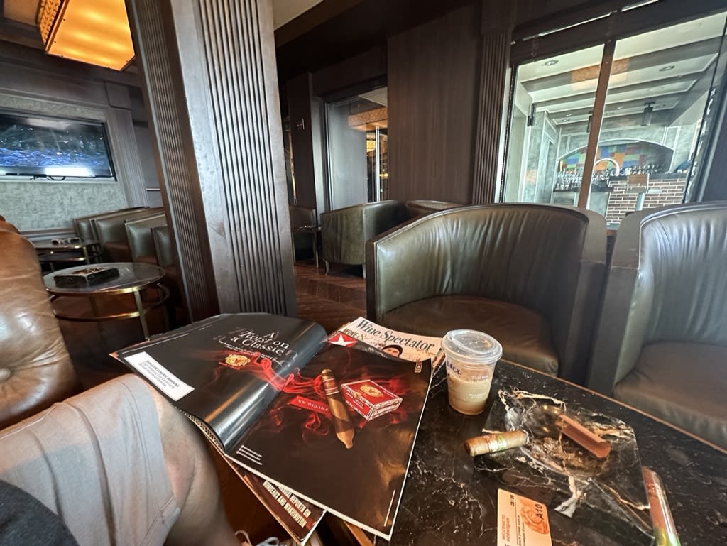 Interior view of a lounge with magazines and coffee on table