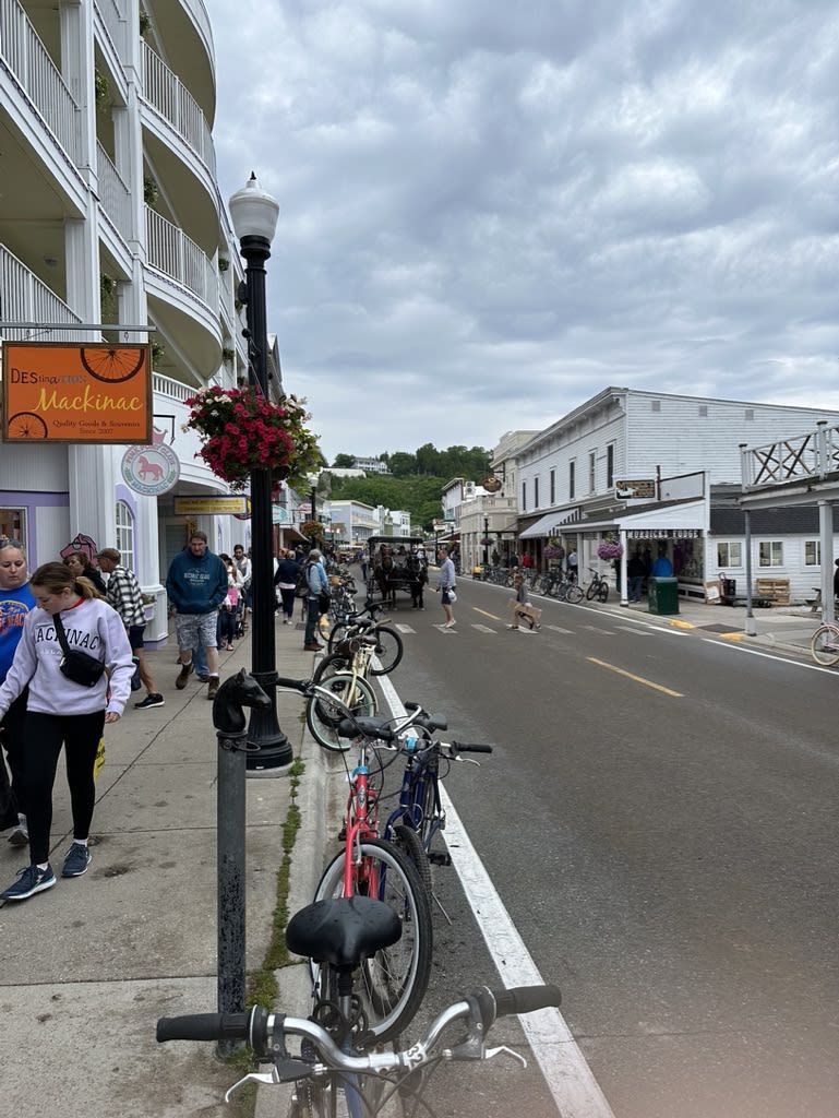 Street scene in town with people and bicycles