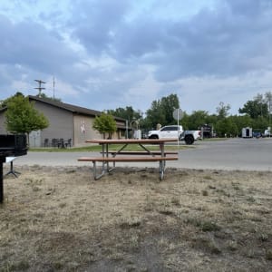 Picnic area with a grill and pavilion in a park
