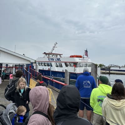 Crowd waiting at a dock for the Star Line ferry.