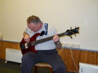 Tom playing bass guitar