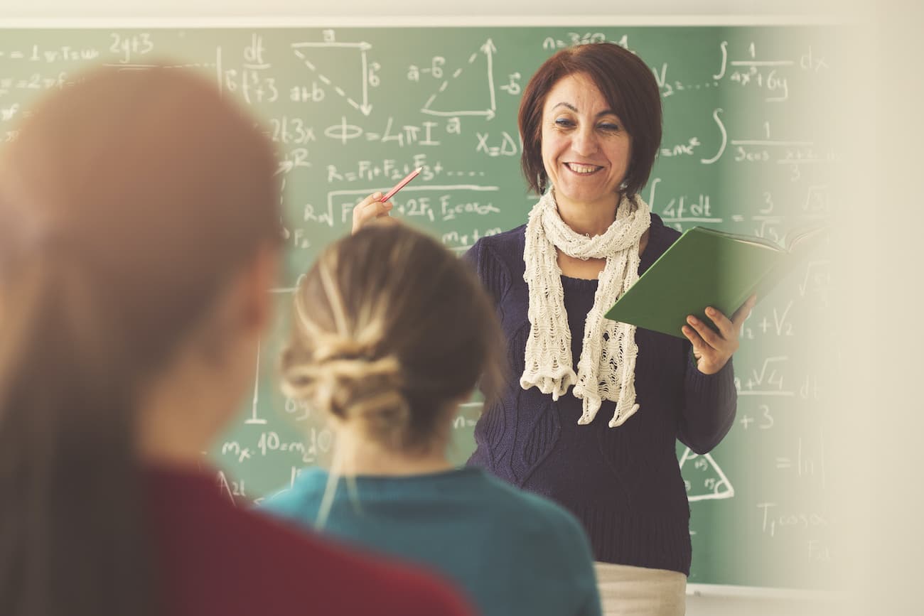 Teacher Posing With Students Stock Photo - Download Image Now - 30