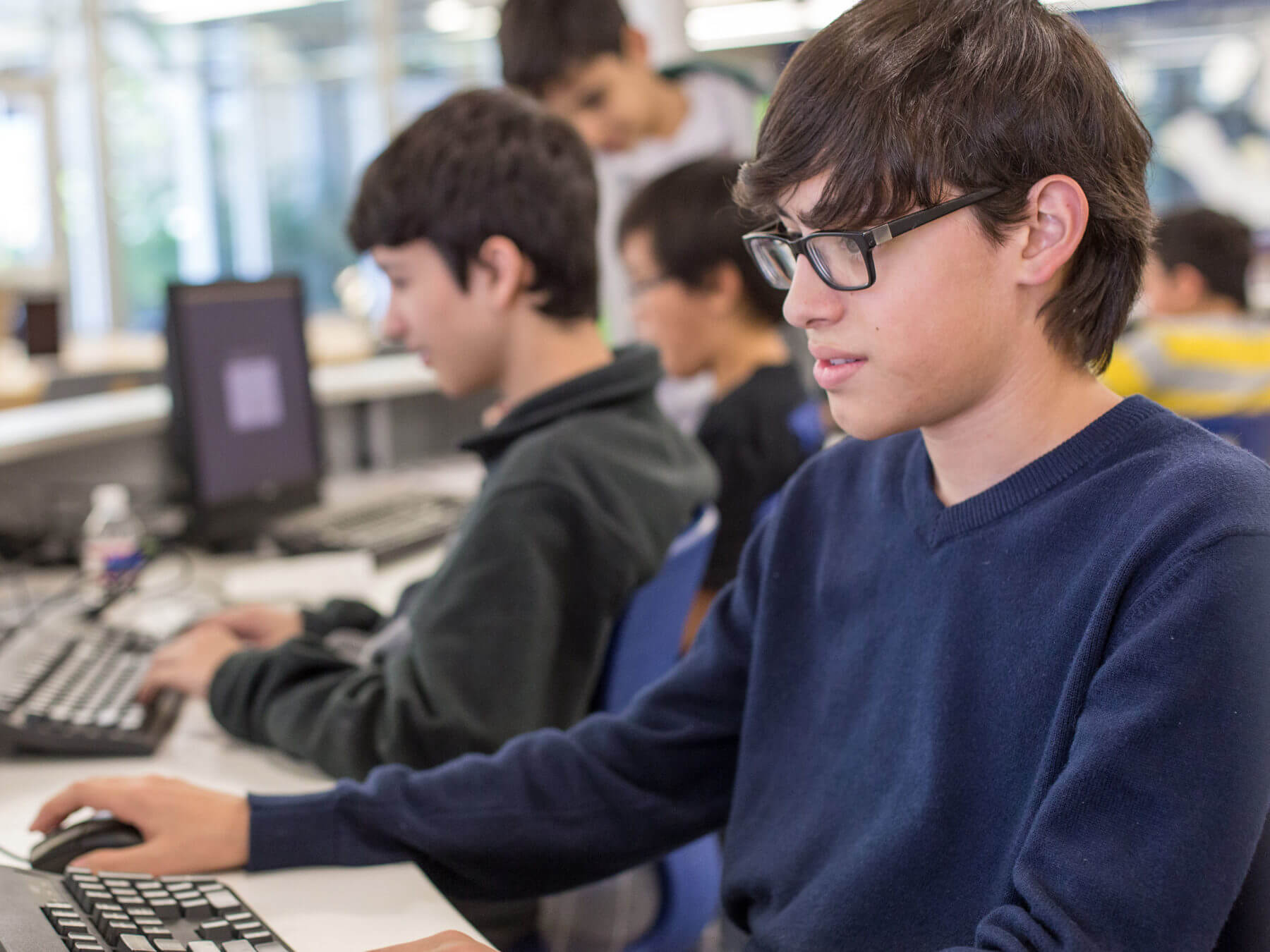 high school students in a compter lab