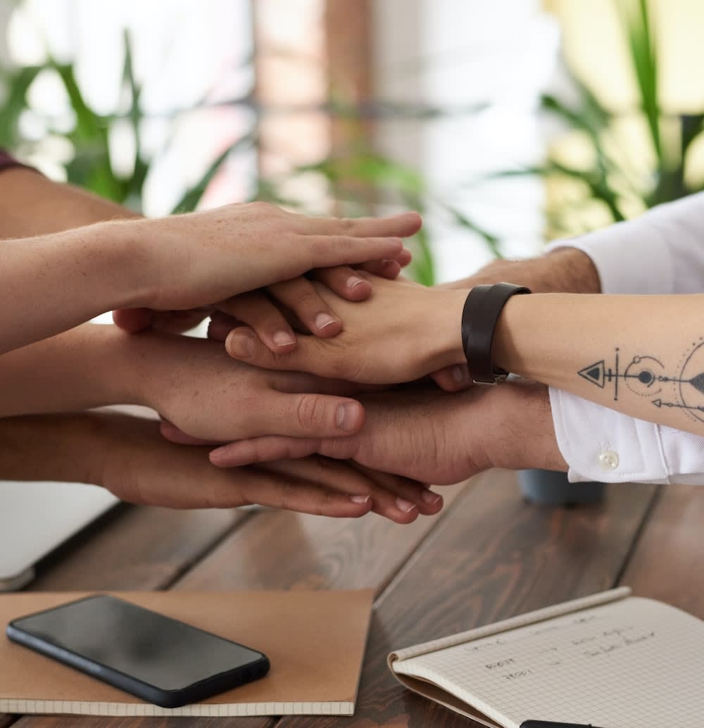 Multiple hands together