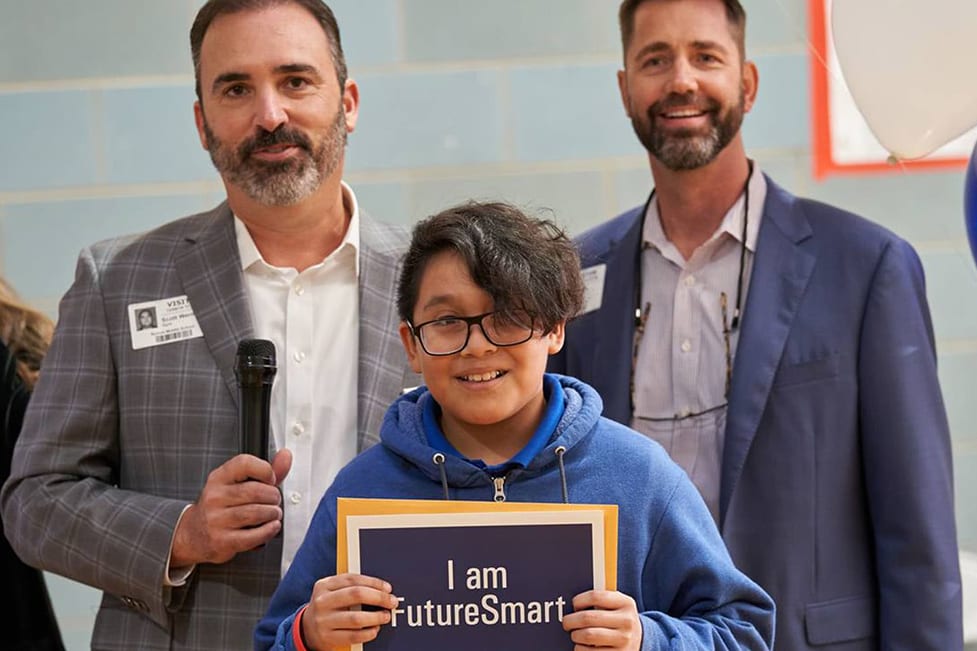 mm-austin-iammassmutual-copy A boy holding up a sign that says "I am FutureSmart".