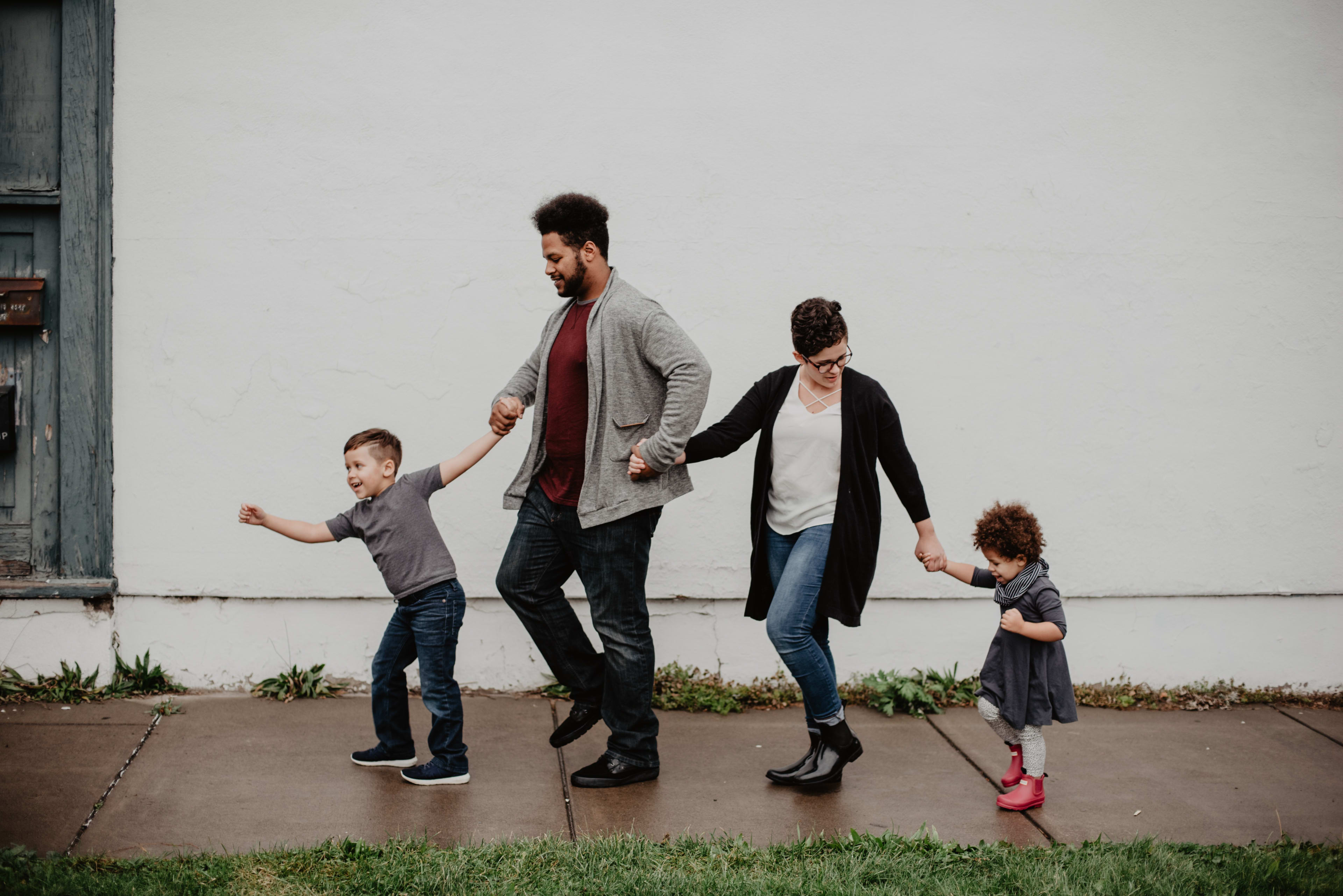 A family of four enjoys a day outside